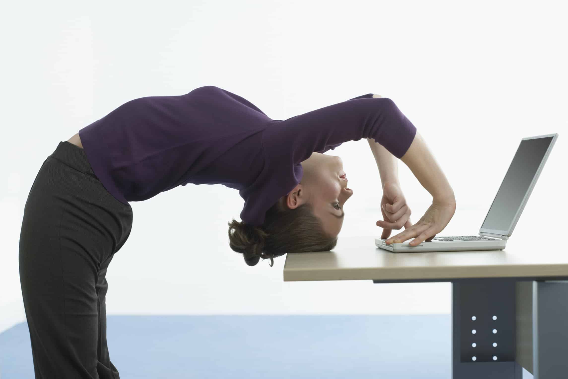 Businesswoman Bending Over Backwards